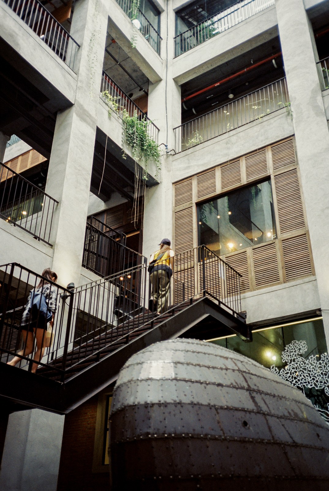 Stairs climbing a concrete courtyard